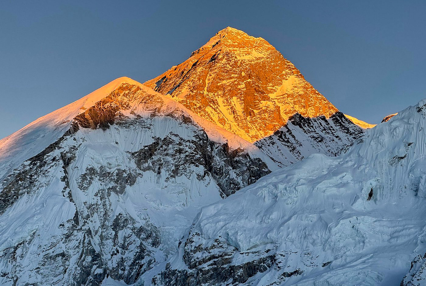 Snow-covered Mount Everest viewed from Kalapathar at golden hour, highlighting the demanding terrain that requires physical preparation for trekking in Nepal