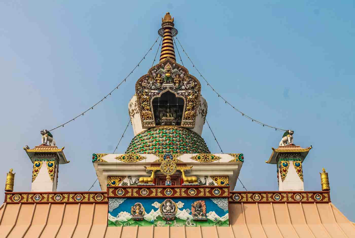Detailed top section of Buddhist stupa in Lumbini showing intricate design and symbolic elements