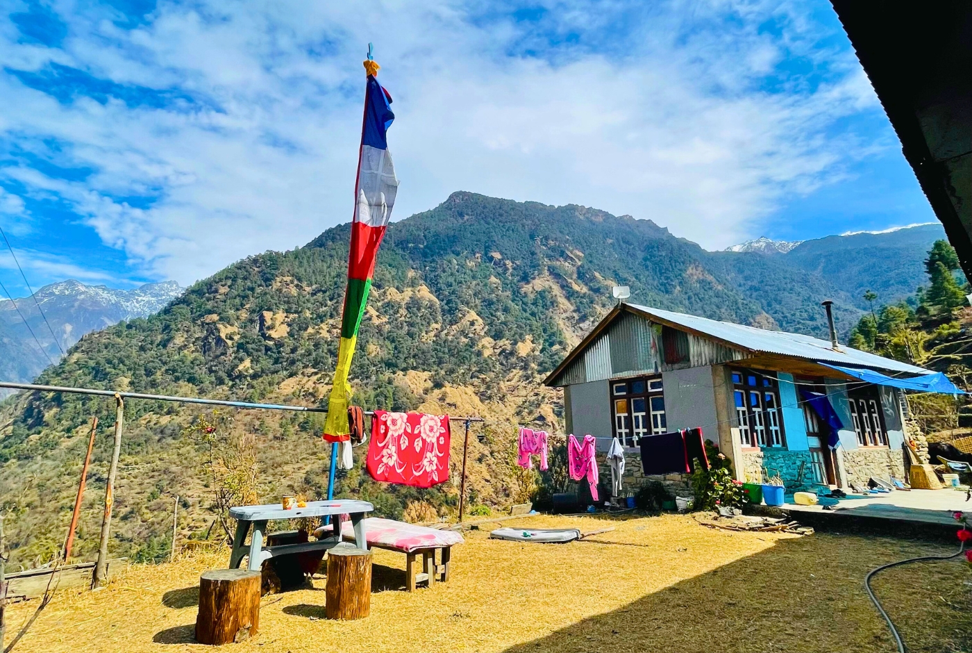 Tamang prayer flags and typical local house in langtang