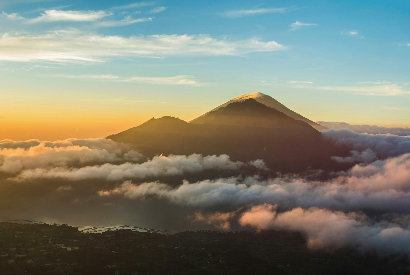 Witnessing A Stunning Sunrise From Mount Batur With Views Of Mount Agung In The Distance, Indonesia