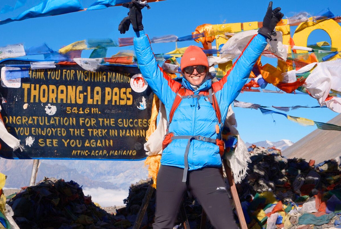 Trekkers walking toward Thorong La Pass during Annapurna Circuit trek showing high altitude terrain and conditions