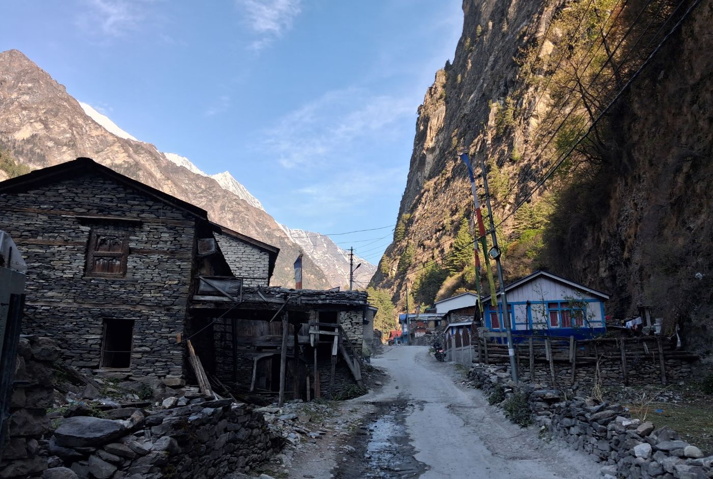 Traditional stone houses and mountain road in Chame village on the Annapurna Circuit Trek