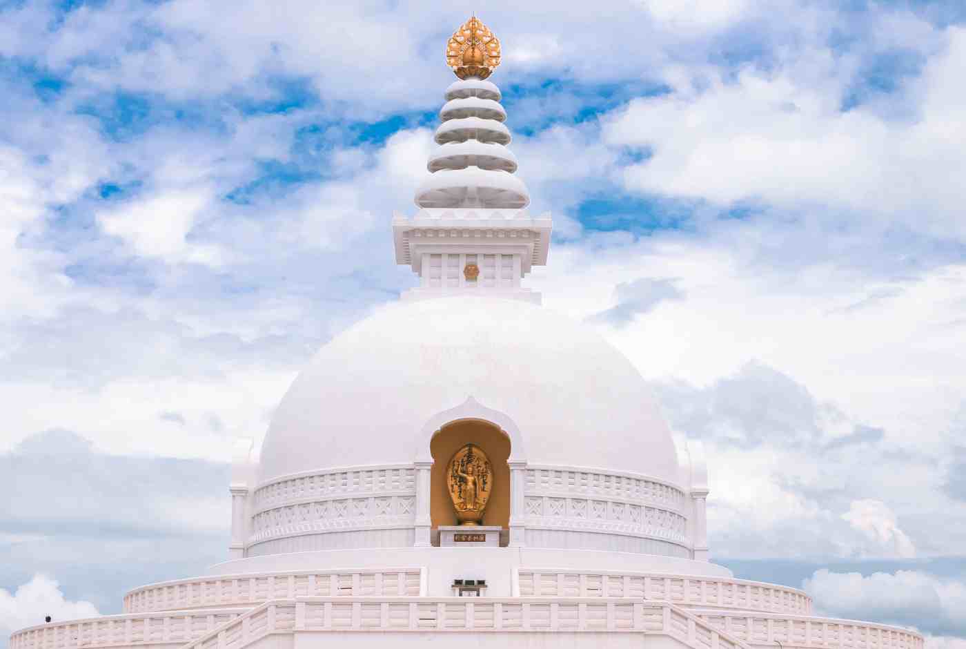 World Peace Pagoda in Lumbini Nepal white stupa structure under open sky with peaceful surroundings