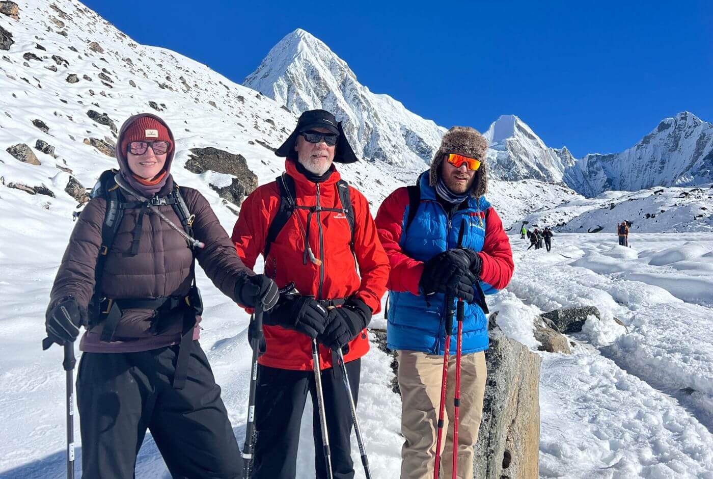 Trekkers on the Everest Base Camp trail in Nepal, highlighting the need for comprehensive travel insurance for high-altitude trekking