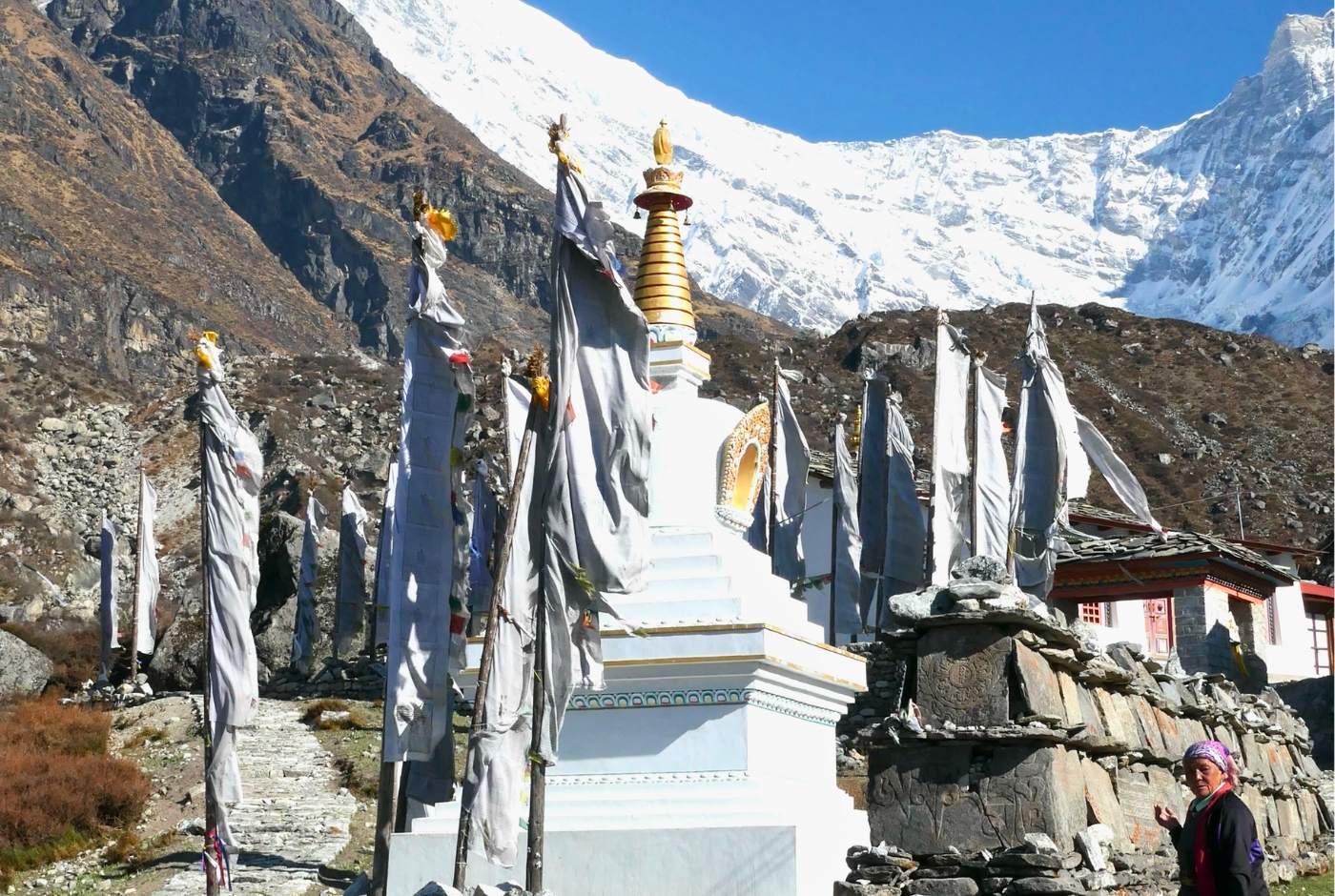 Kyanjin Gompa monastery with prayer flags on the standard 10-day Langtang Valley Trek itinerary