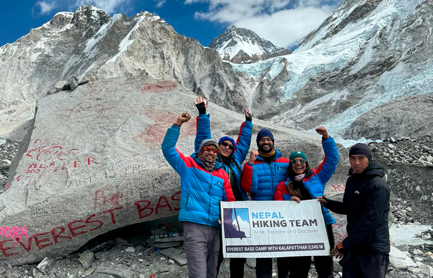 Successful trekkers at Everest Base Camp with Nepal Hiking Team, showcasing safe high-altitude trekking with proper insurance