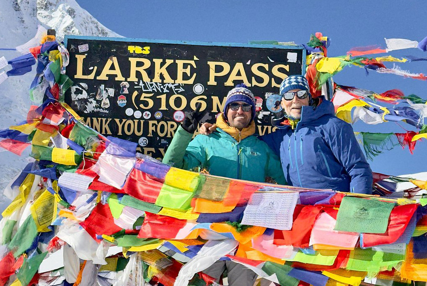 Trekkers standing at Larkya La Pass during the hardest day of the Manaslu Circuit Trek.